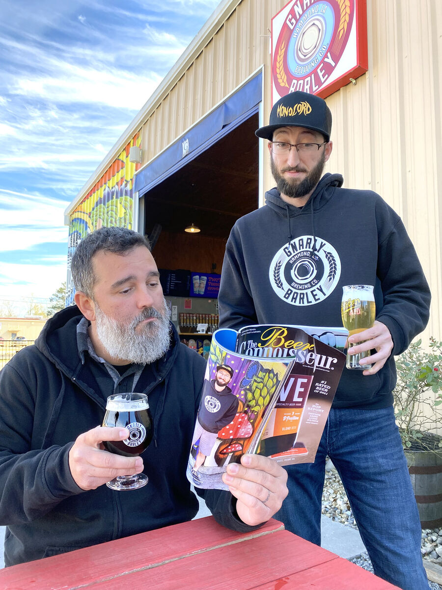 Gnarly Barly Brewers Reading Their Reviews in The Beer Connoisseur Magazine.