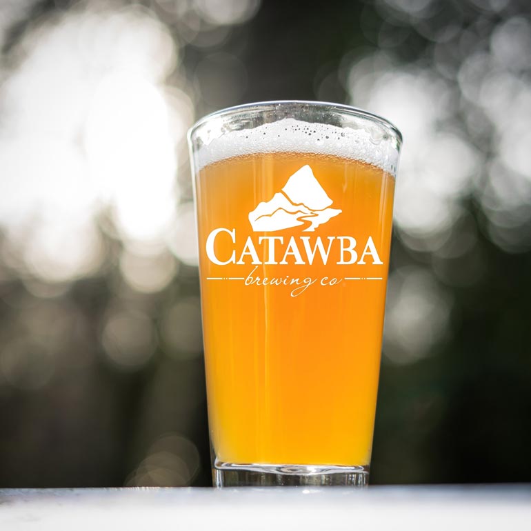 catawba brewing glassware sitting outside in beautiful lighting