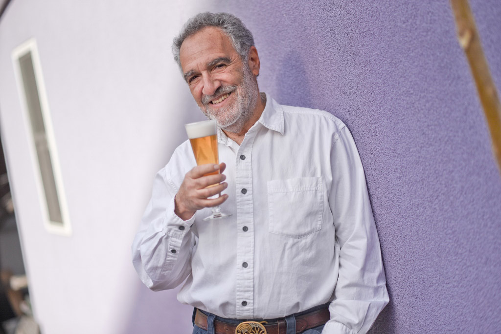 charlie papazian with beer glass