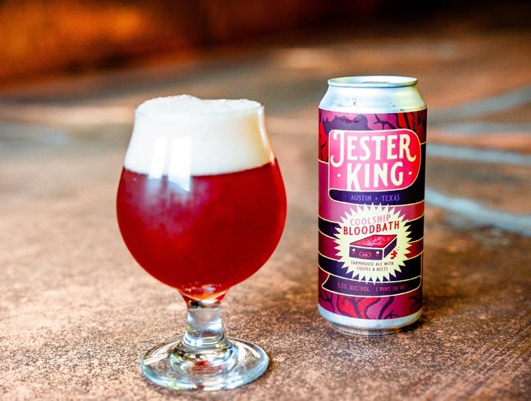 jester king farmhouse ale with coffee and beets glass and can atop a table 