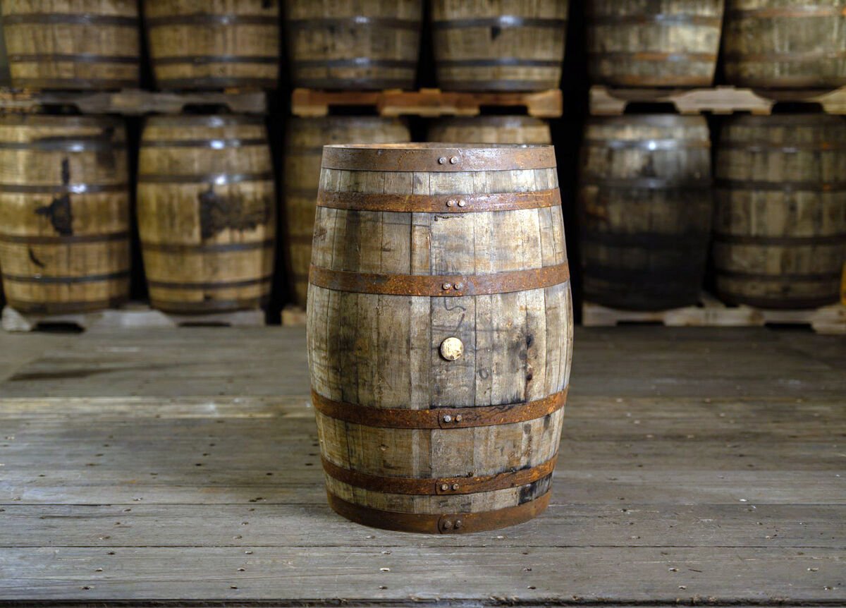 collection of whiskey barrels in storage