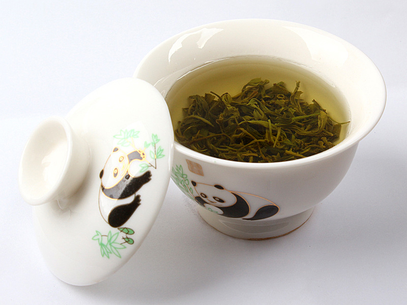 loose leaf green tea in cute panda mug