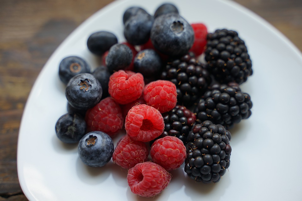 plate of blueberries, raspberries and blackberries