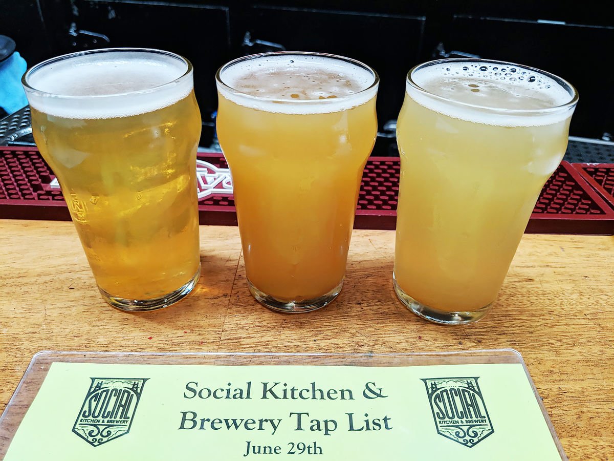 Social Kithchen and Bar Tap List with flight of three beers.
