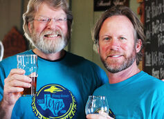 Mike Hagan of Mike-Ro-Brewery and Keith Schlabs of Flying Saucer hoist a glass to craft beer in 2017.