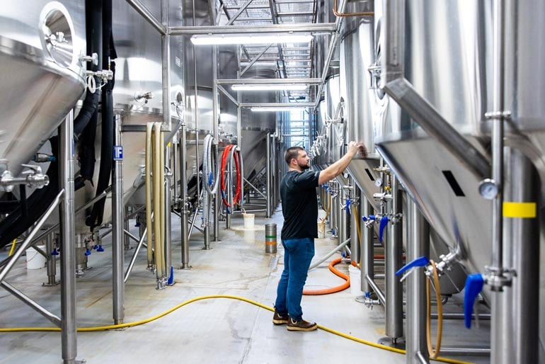 brewers works on collaboration beer at tree house brewing co