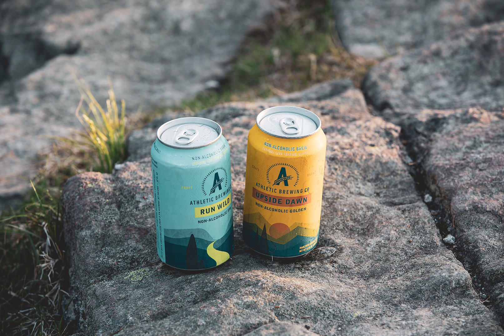 Cans of Run Wild and Upside Dawn Non-Alcoholic Beer by Athletic Brewing